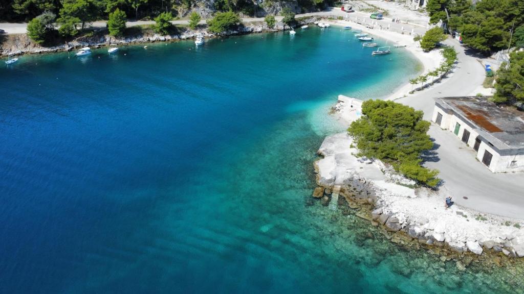 an aerial view of a beach with blue water at Hidden Sunset in Selca