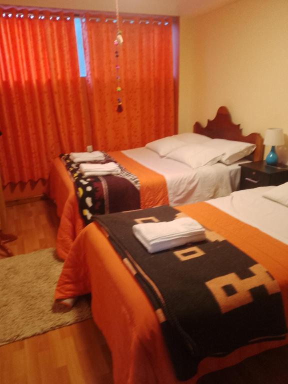 Postel nebo postele na pokoji v ubytování hostal ollantaytambo apartments