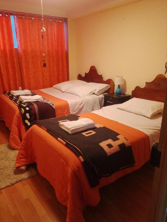 Postel nebo postele na pokoji v ubytování hostal ollantaytambo apartments