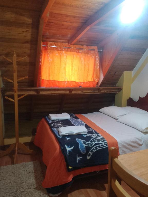 Postel nebo postele na pokoji v ubytování hostal ollantaytambo apartments
