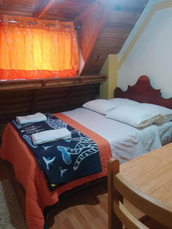 Postel nebo postele na pokoji v ubytování hostal ollantaytambo apartments