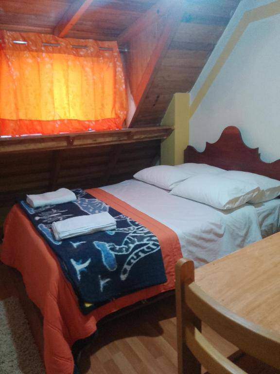 Postel nebo postele na pokoji v ubytování hostal ollantaytambo apartments