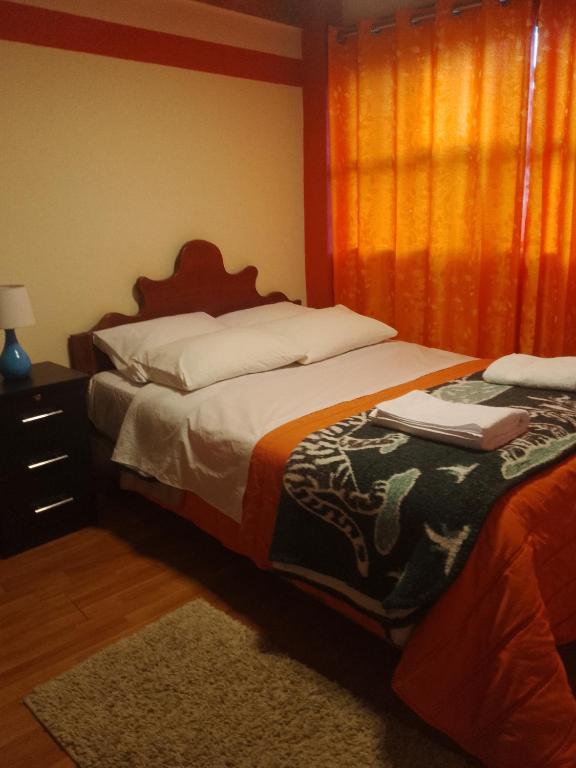 Postel nebo postele na pokoji v ubytování hostal ollantaytambo apartments
