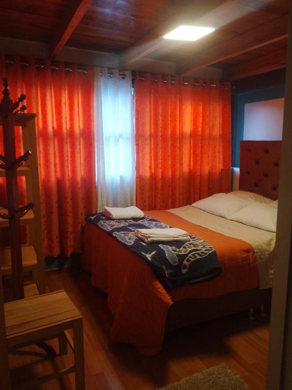 Postel nebo postele na pokoji v ubytování hostal ollantaytambo apartments