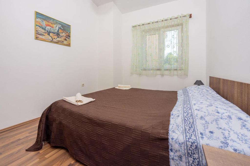 Postel nebo postele na pokoji v ubytování Apartment David
