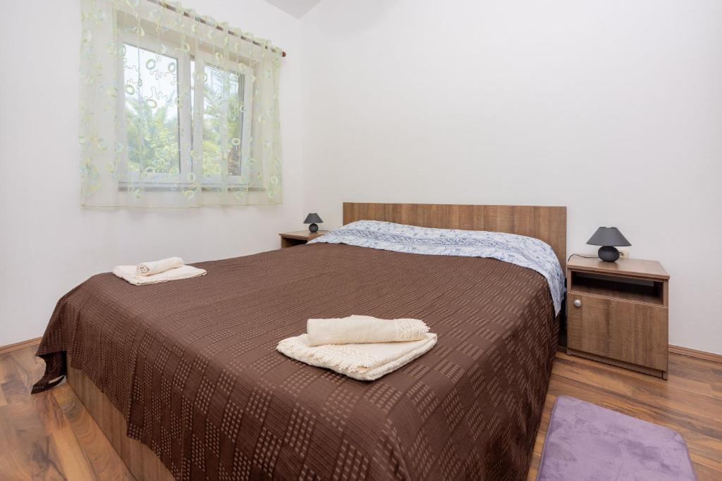 Postel nebo postele na pokoji v ubytování Apartment David