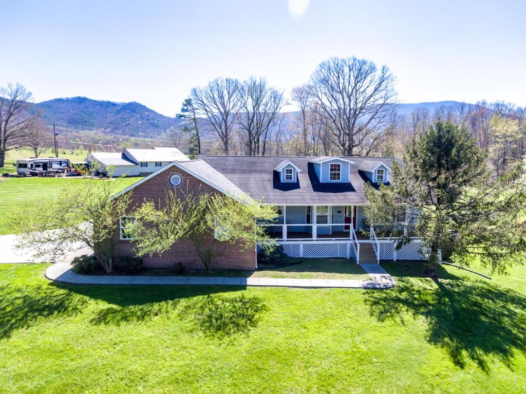 an aerial view of a house with a yard at Bears Valley Inn - Great Mtn Views - Private Pool Club - Less than 15 Min to Attractions - EZ Access Roads - Luv Dogs! in Sevierville