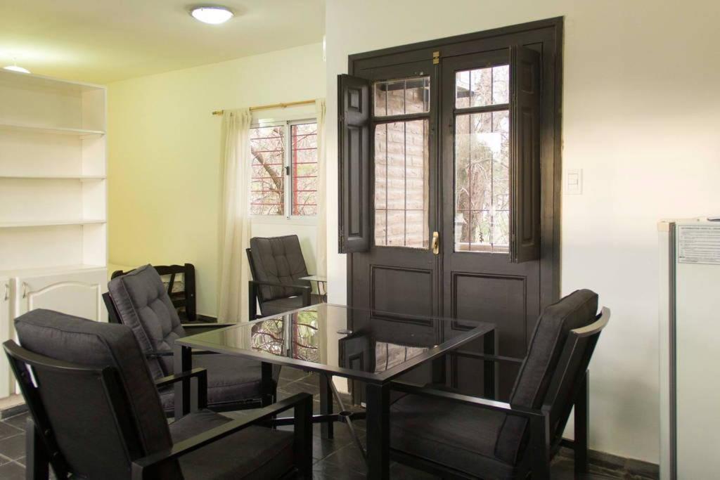 a conference room with a glass table and chairs at Del Fundador in San Luis