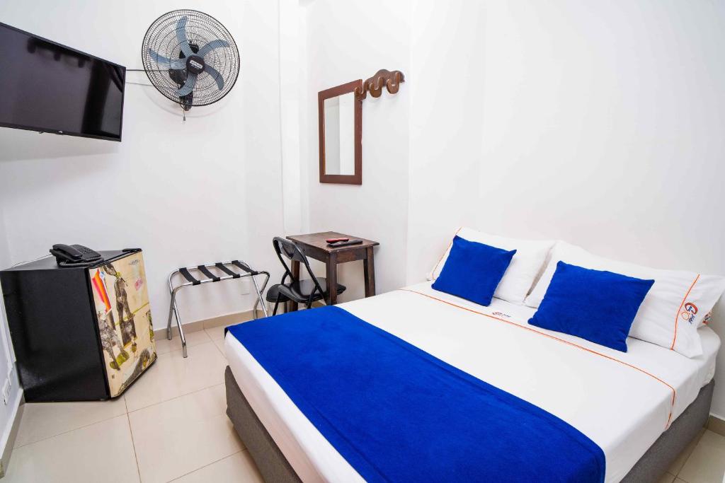 Postel nebo postele na pokoji v ubytování Hotel Casa 10