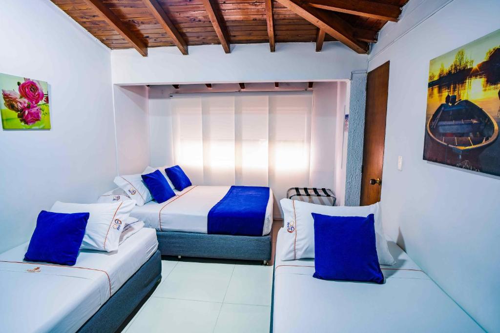 Postel nebo postele na pokoji v ubytování Hotel Casa 10