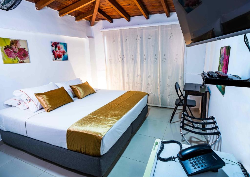 Postel nebo postele na pokoji v ubytování Hotel Casa 10