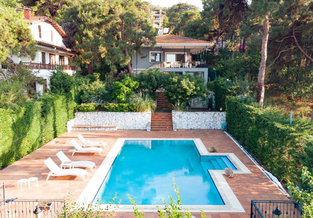 a swimming pool in the backyard of a house at Homie Suites - 3br villa w pool in Heybeliada in Adalar