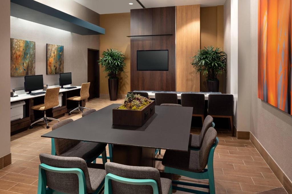 a conference room with a table and chairs at Courtyard Seattle Downtown / Pioneer Square in Seattle