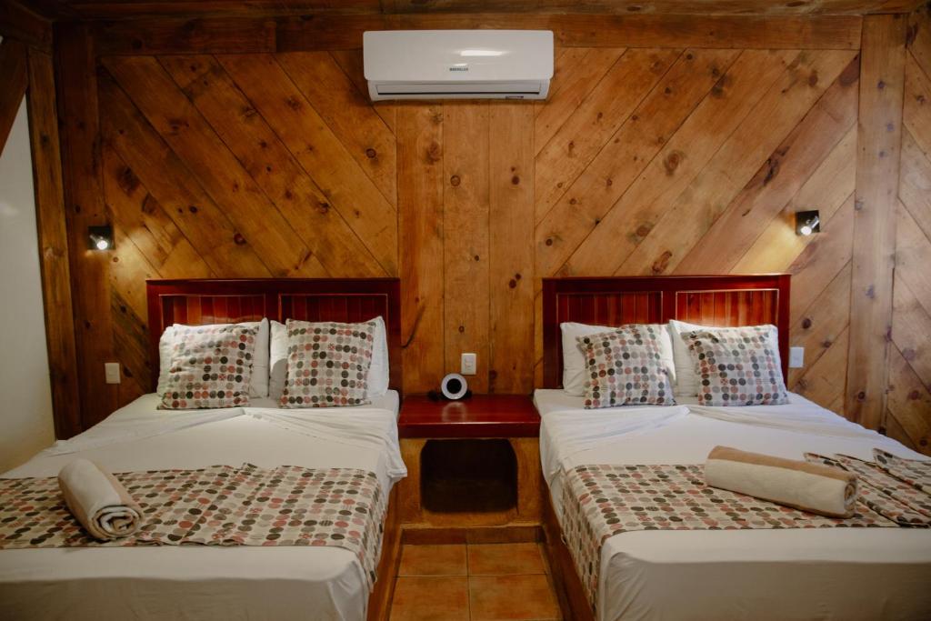 Postel nebo postele na pokoji v ubytování Aluxes Bacalar