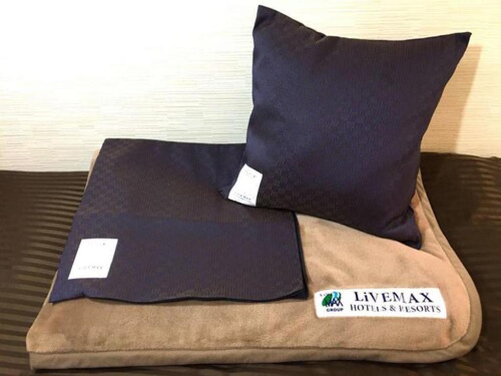 Postel nebo postele na pokoji v ubytování HOTEL LiVEMAX Asakusabashi-Eki Kitaguchi