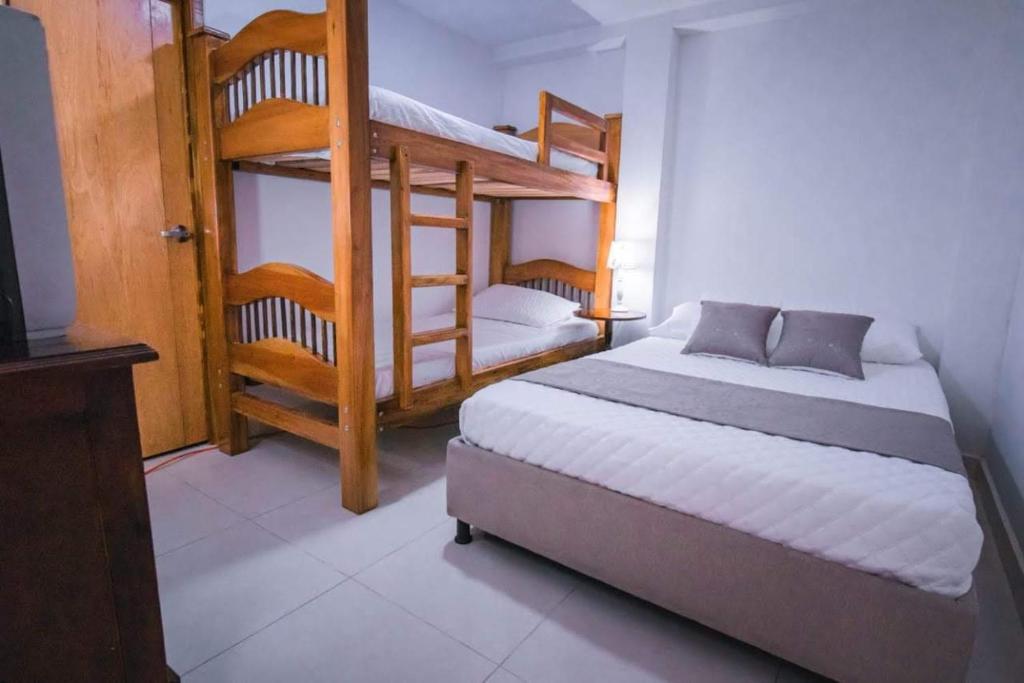 Postel nebo postele na pokoji v ubytování CASA SANTA CIRCASIA