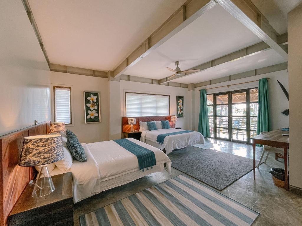 Postel nebo postele na pokoji v ubytování Kaimana Resort Siargao