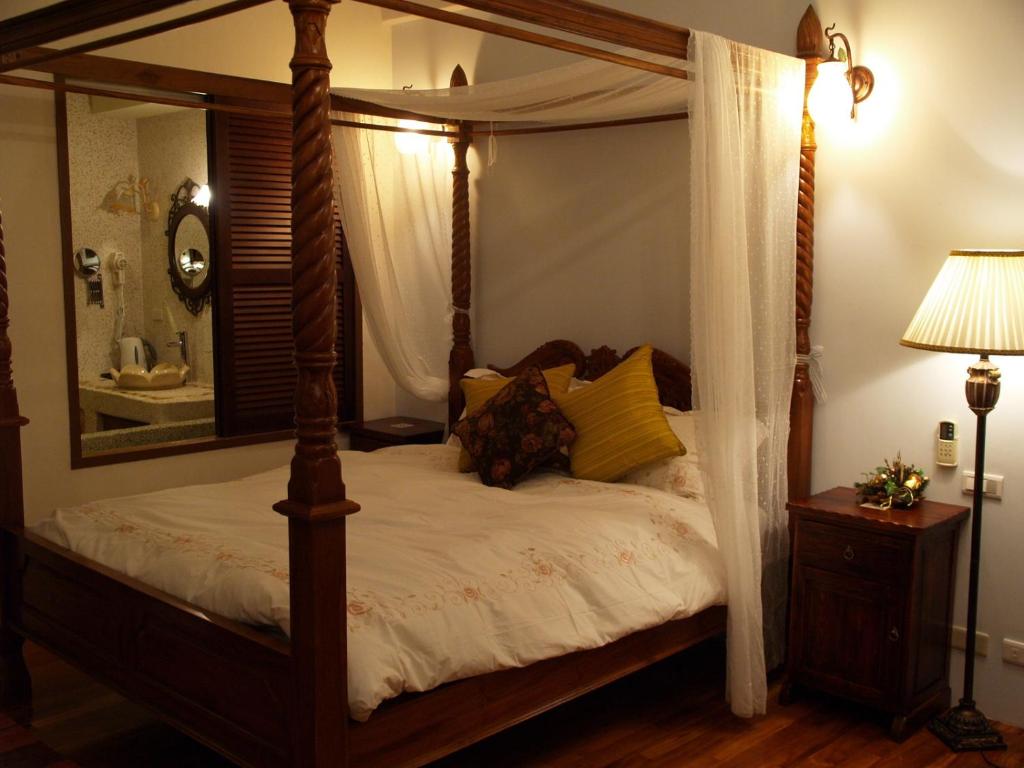 Postel nebo postele na pokoji v ubytování Kenting Tuscany Resort