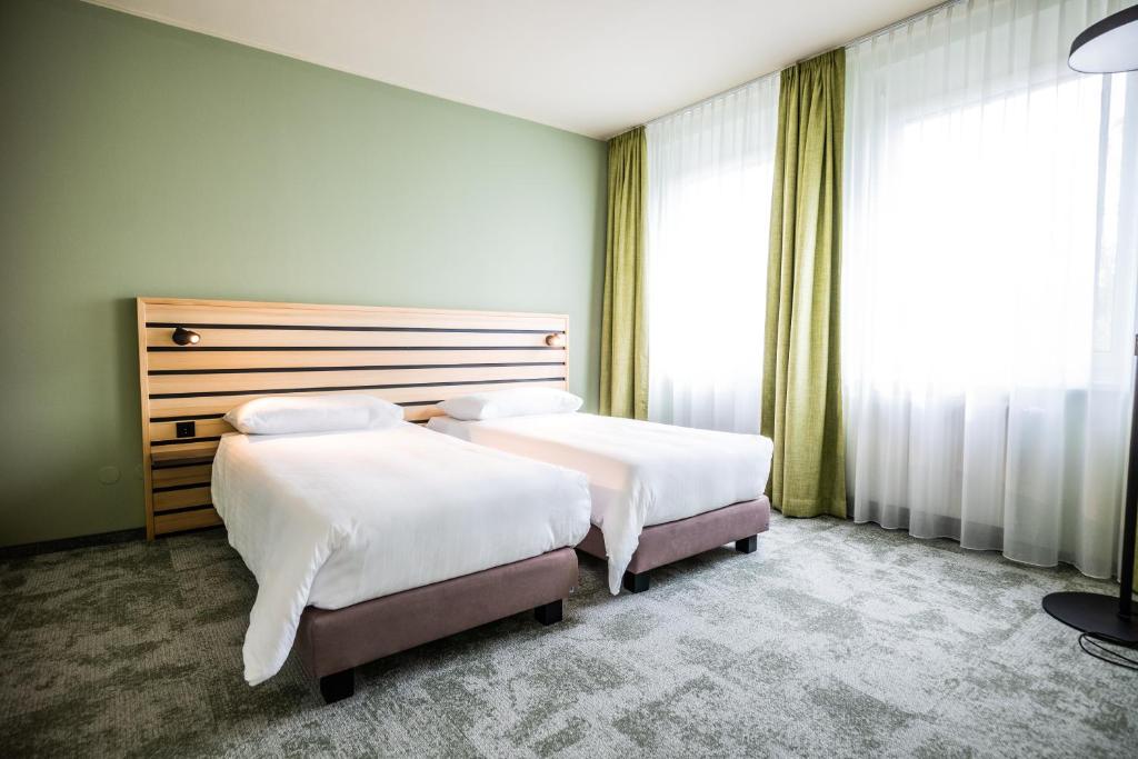 Postel nebo postele na pokoji v ubytování flexymotel Spielberg