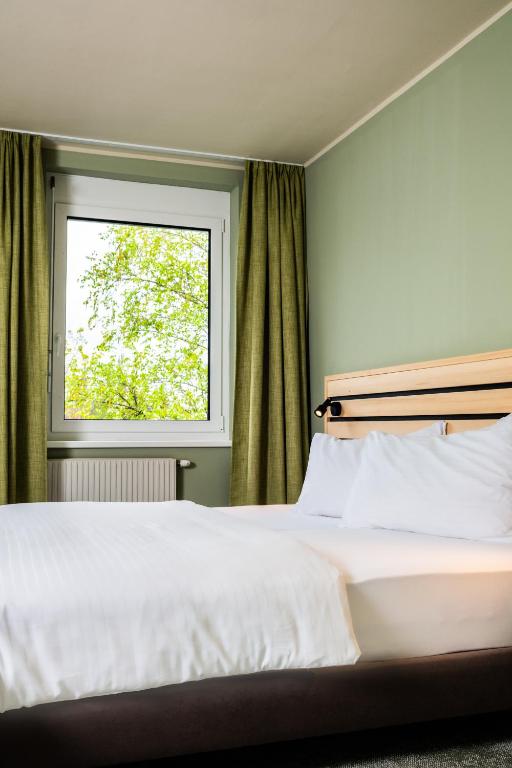 Postel nebo postele na pokoji v ubytování flexymotel Spielberg
