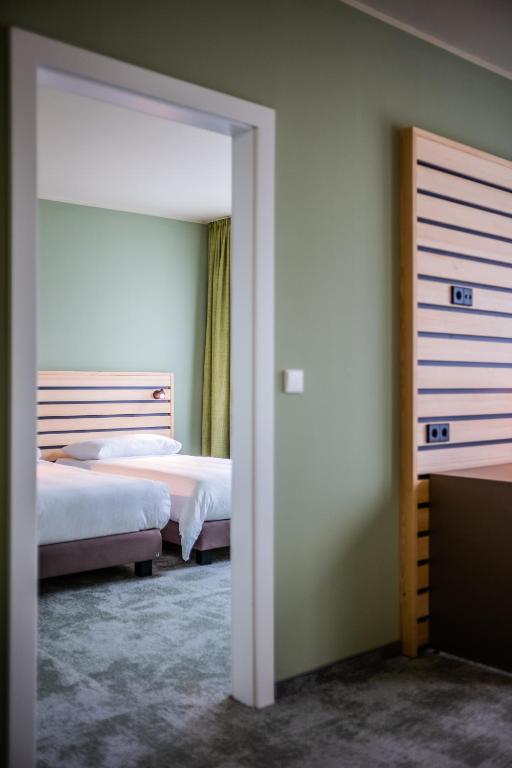 Postel nebo postele na pokoji v ubytování flexymotel Spielberg