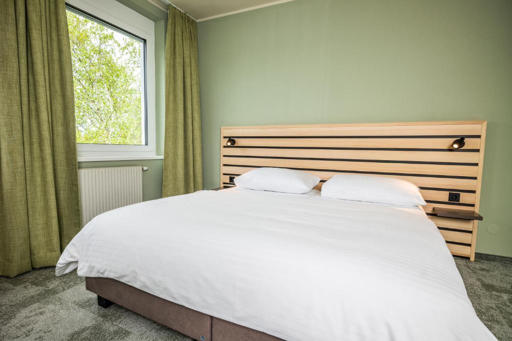 Postel nebo postele na pokoji v ubytování flexymotel Spielberg