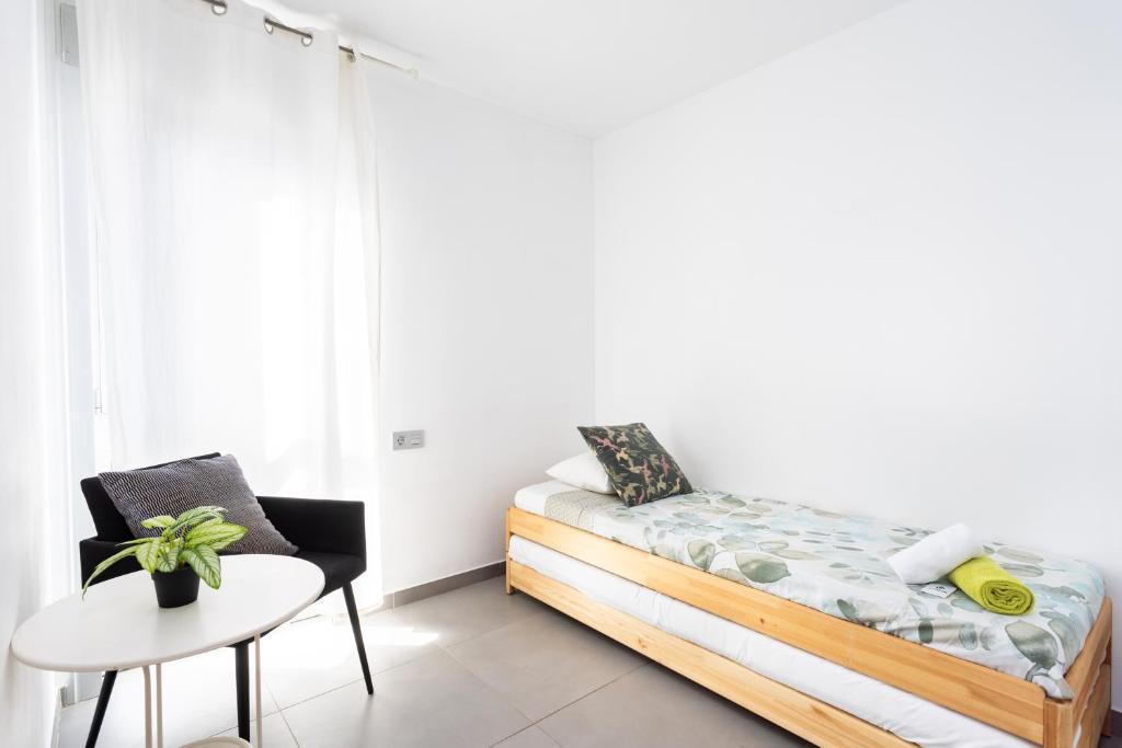 Posteľ alebo postele v izbe v ubytovaní Apartamentos Las Terrazas de Sotavento
