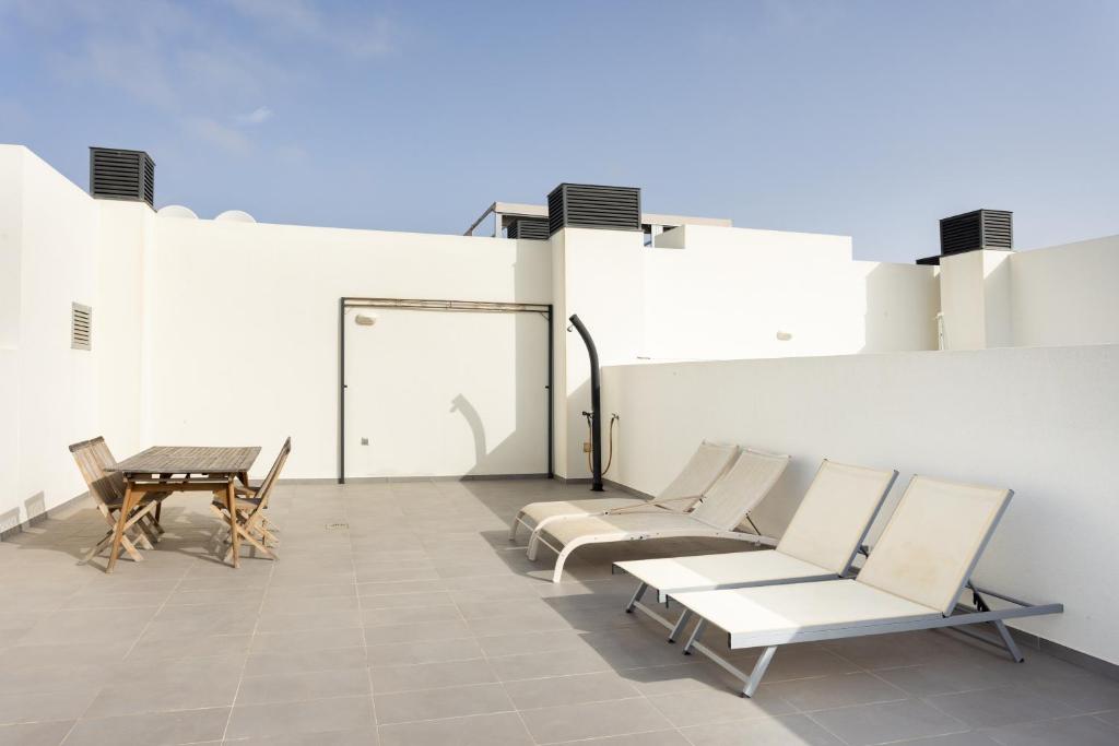 Posedenie v ubytovaní Apartamentos Las Terrazas de Sotavento