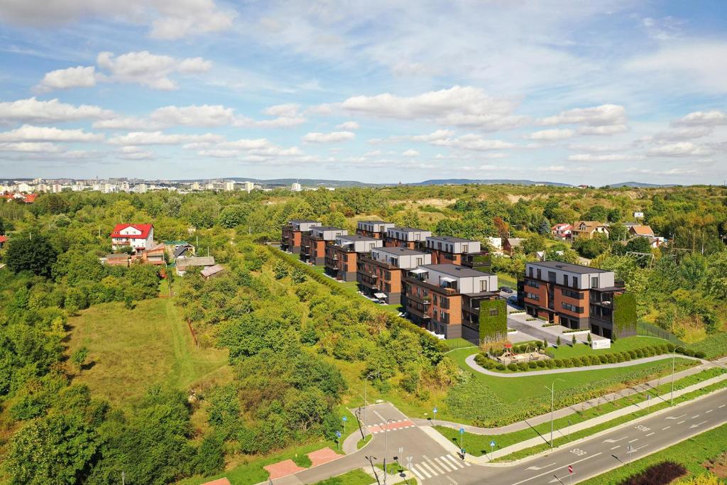 an overhead view of an apartment complex with a road at Apartament Wietrznia z tarasem, ogródkiem, parkingiem, na prestiżowym osiedlu obok rezerwatu przyrody NEW!!! in Kielce