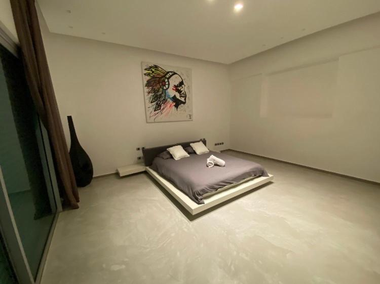 En eller flere senge i et værelse på Villa Zait dream