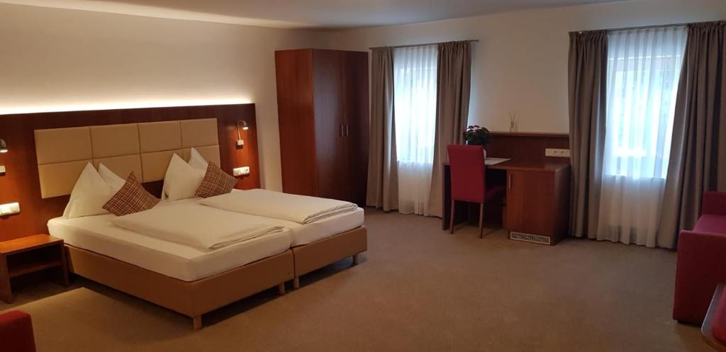 Postel nebo postele na pokoji v ubytování Hotel Restaurant Häupl