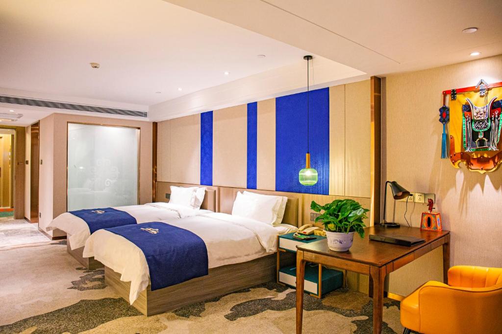 Tempat tidur dalam kamar di Uiles Hotel