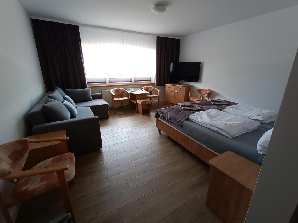 Postel nebo postele na pokoji v ubytování Dom Wczasowy Larix