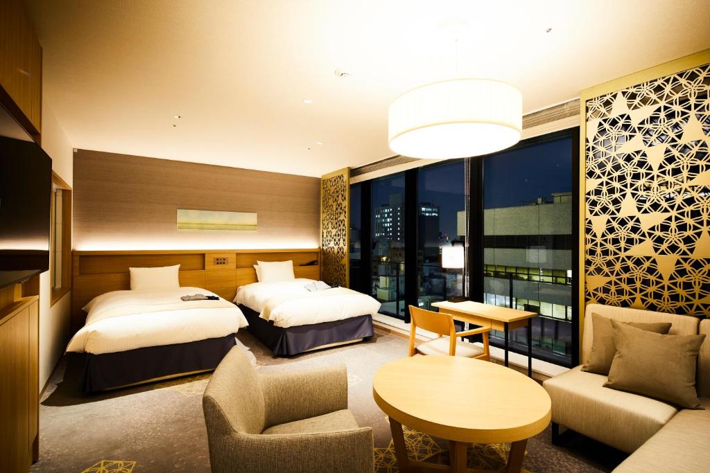 Postel nebo postele na pokoji v ubytování Hotel Intergate Hiroshima