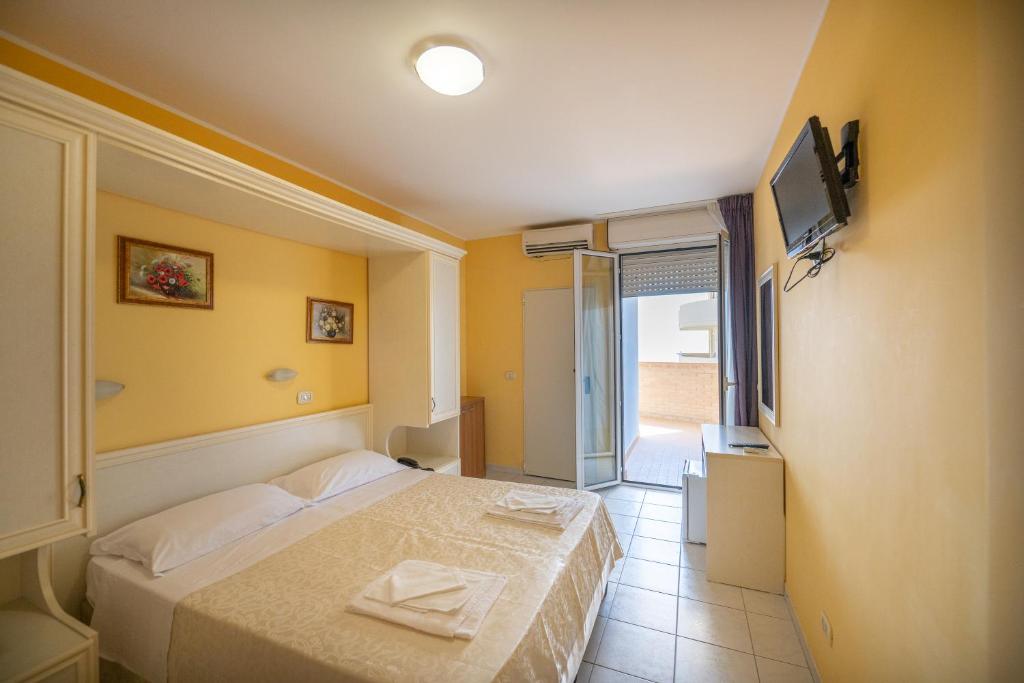 Postel nebo postele na pokoji v ubytování Di Matteo Hotel