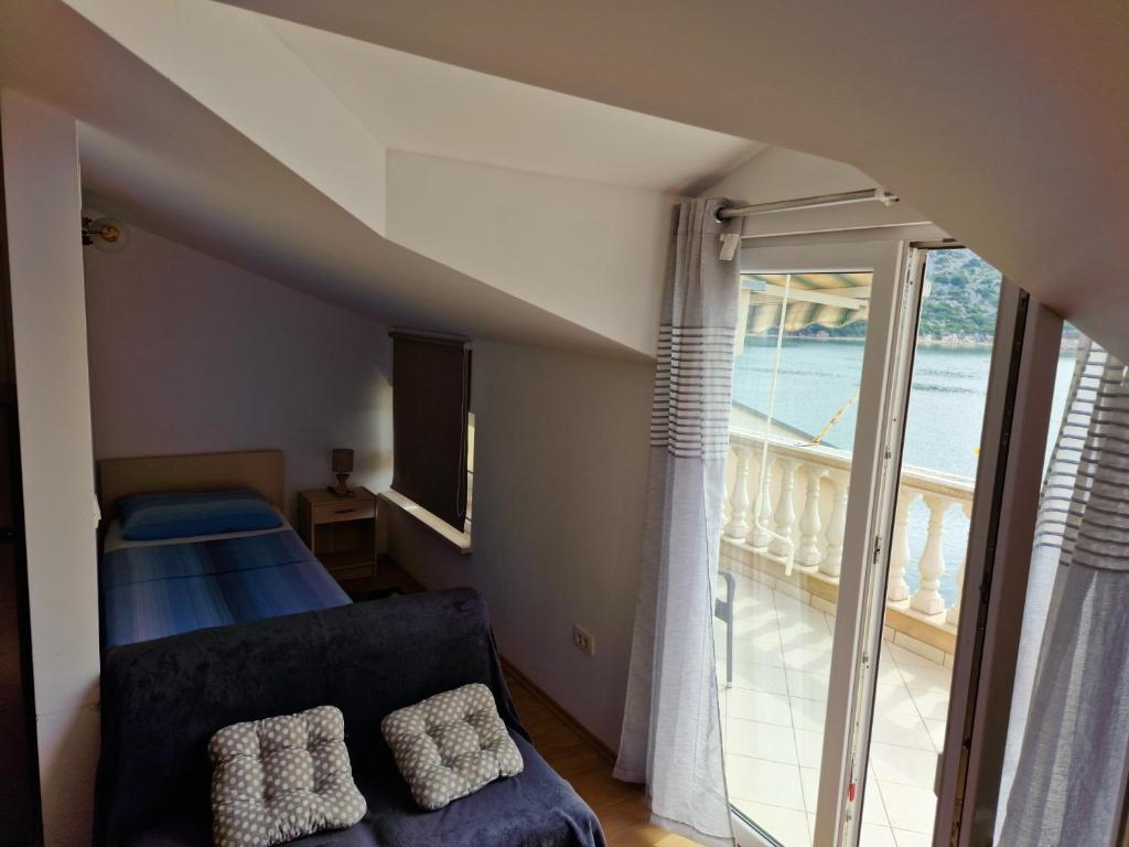 Postel nebo postele na pokoji v ubytování Apartments Damić