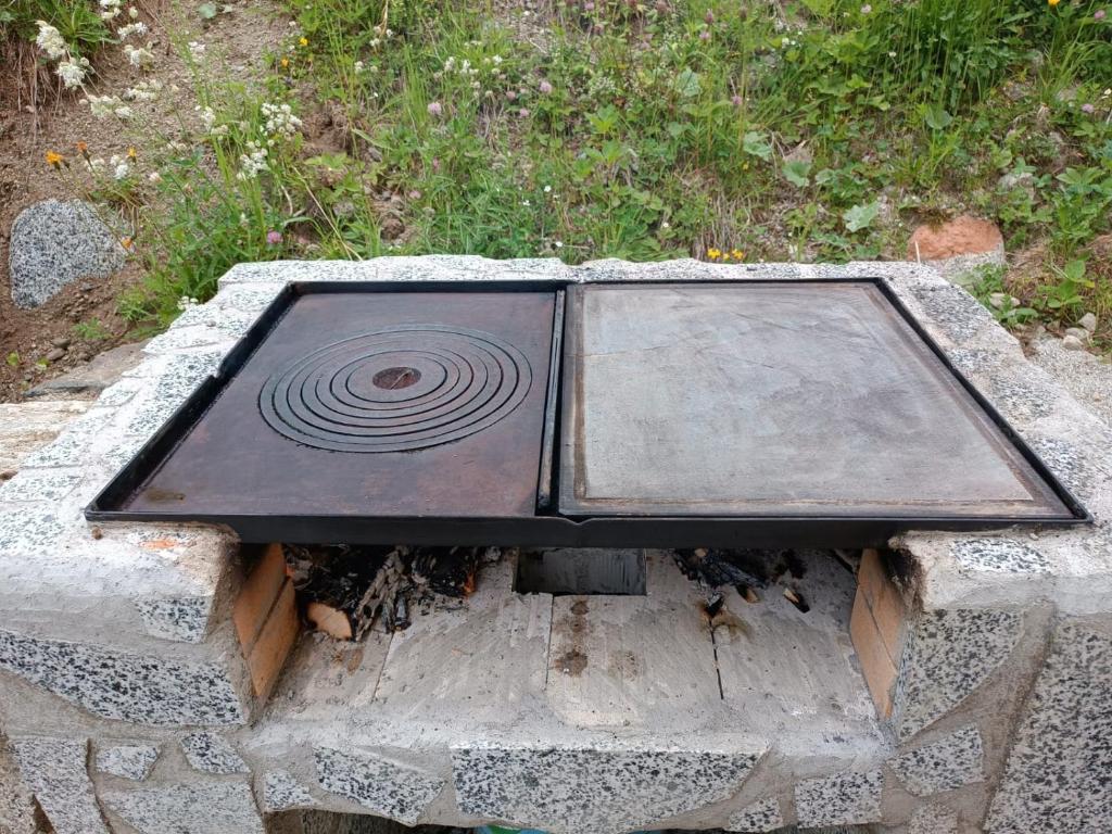 a stone table with a spiral on top of it at Appartemento Casa Giuli in Passo del Tonale