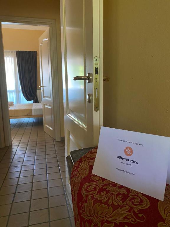 Postel nebo postele na pokoji v ubytování Albergo Etico Cesenatico