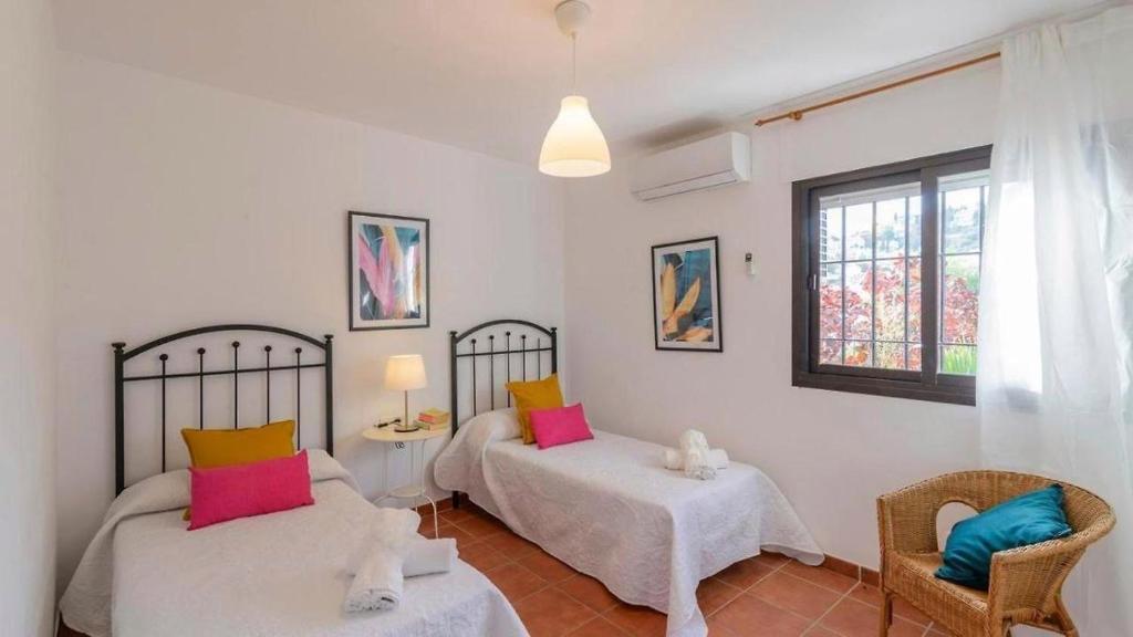 Postel nebo postele na pokoji v ubytování VILLA CARMEN MENYBER