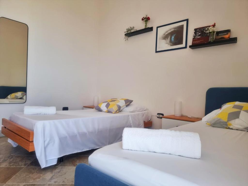 Posteľ alebo postele v izbe v ubytovaní Al Vecchio Carrubo - Lovely 2-rooms house & patio