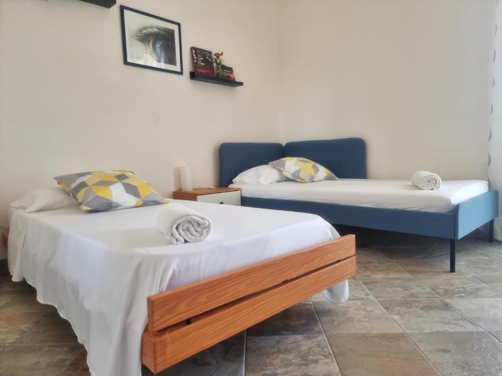 Posteľ alebo postele v izbe v ubytovaní Al Vecchio Carrubo - Lovely 2-rooms house & patio