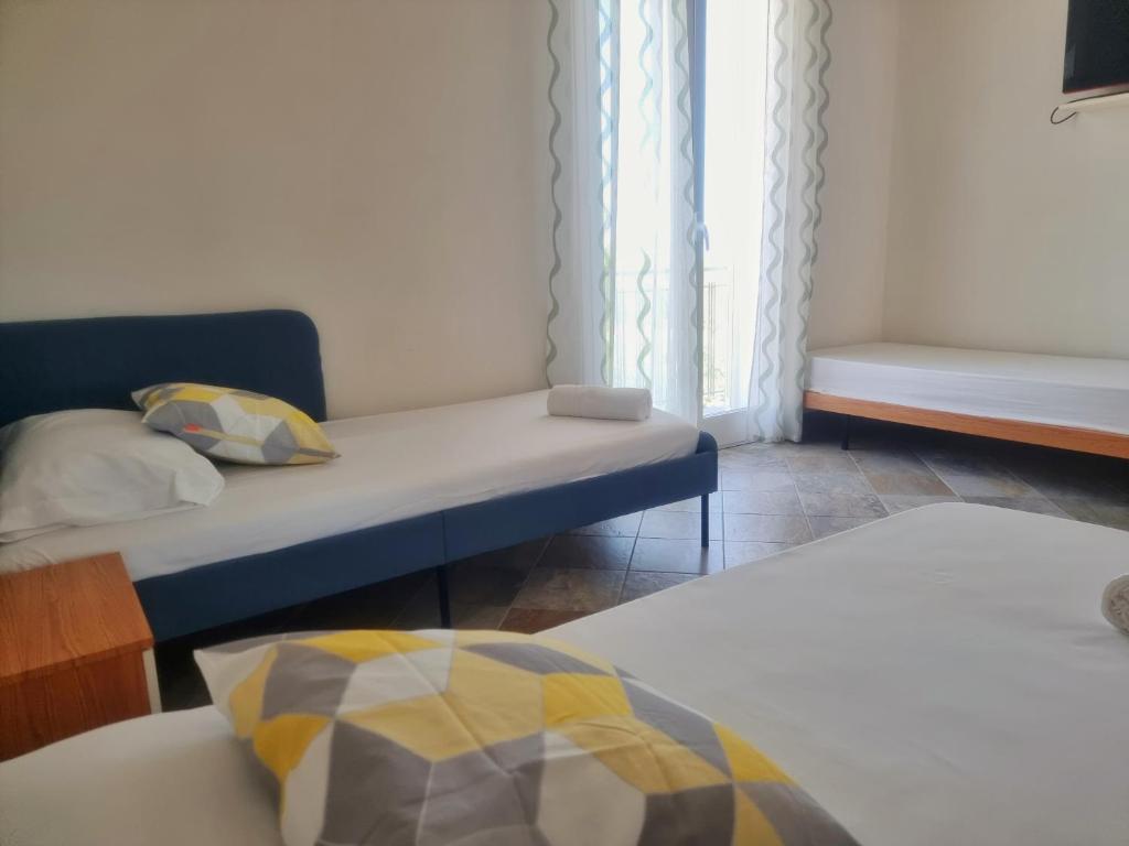 Posteľ alebo postele v izbe v ubytovaní Al Vecchio Carrubo - Lovely 2-rooms house & patio