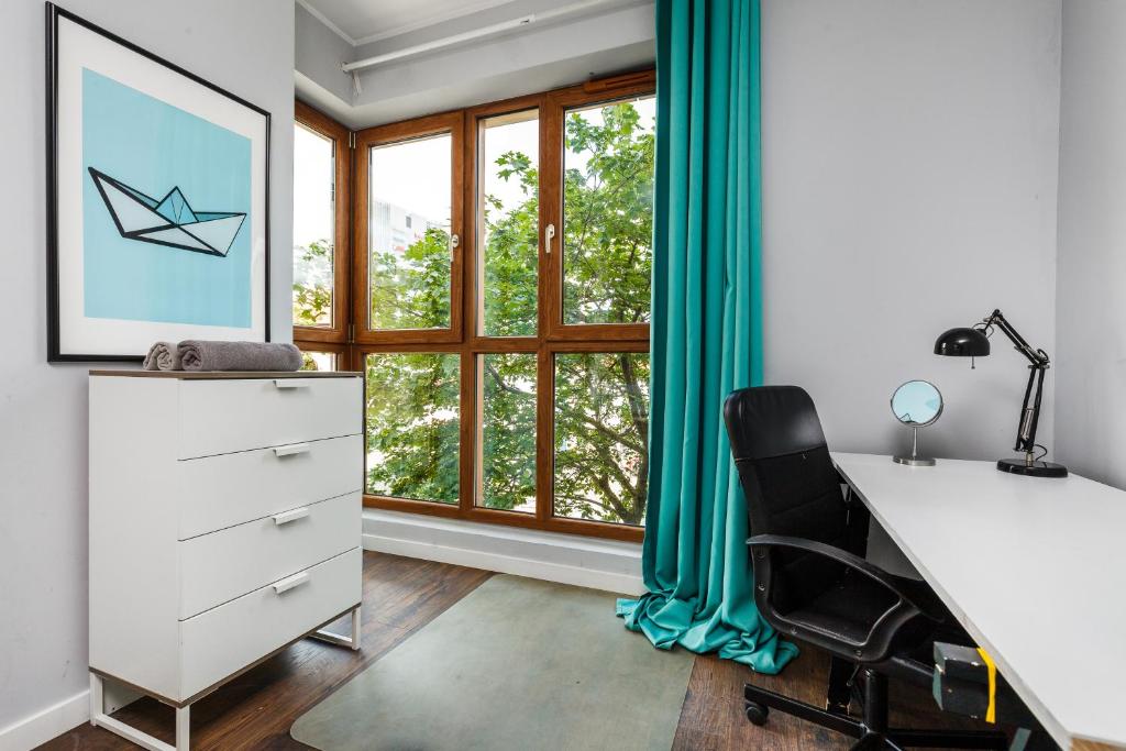 TV a/nebo společenská místnost v ubytování Quattro Loft Hostel