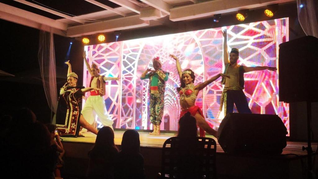 a group of people dancing on a stage at Alannia Costa Dorada in Platja de l’Almadrava