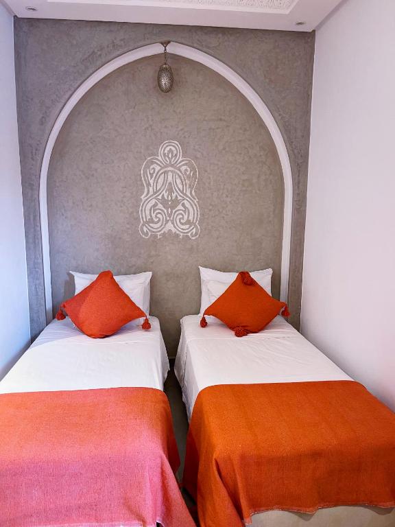 Postel nebo postele na pokoji v ubytování Riad Al Hamama