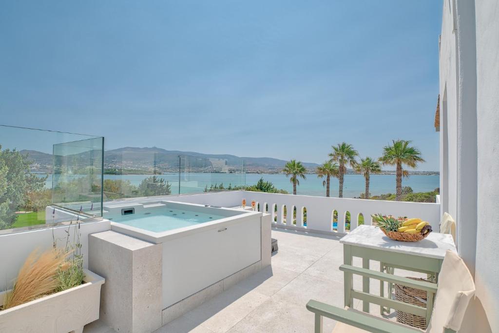 a hot tub on the balcony of a house at Marinatou Suites in Antiparos Town