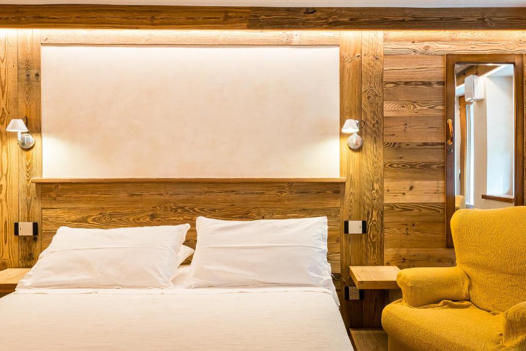 Postel nebo postele na pokoji v ubytování Le Moulin Des Aravis