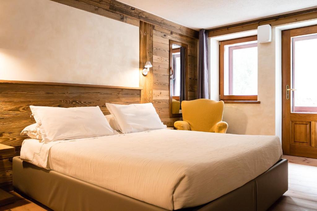 Postel nebo postele na pokoji v ubytování Le Moulin Des Aravis