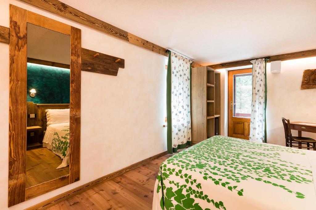 Postel nebo postele na pokoji v ubytování Le Moulin Des Aravis