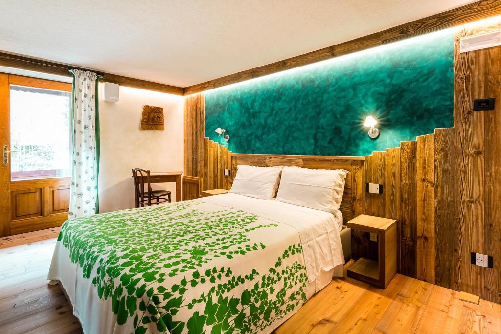 Postel nebo postele na pokoji v ubytování Le Moulin Des Aravis